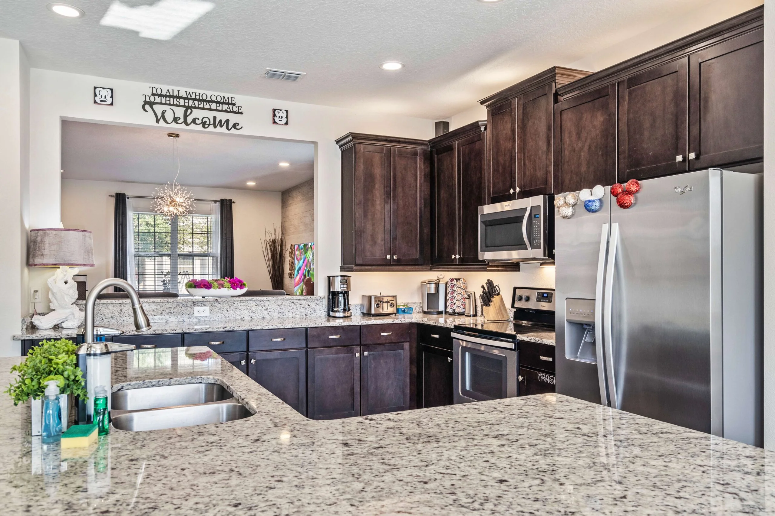 Gourmet kitchen with granite counters at 450 Burma vacation home near Disney