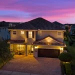 Front of 450 Burma luxury vacation home at night in Encore at Reunion West