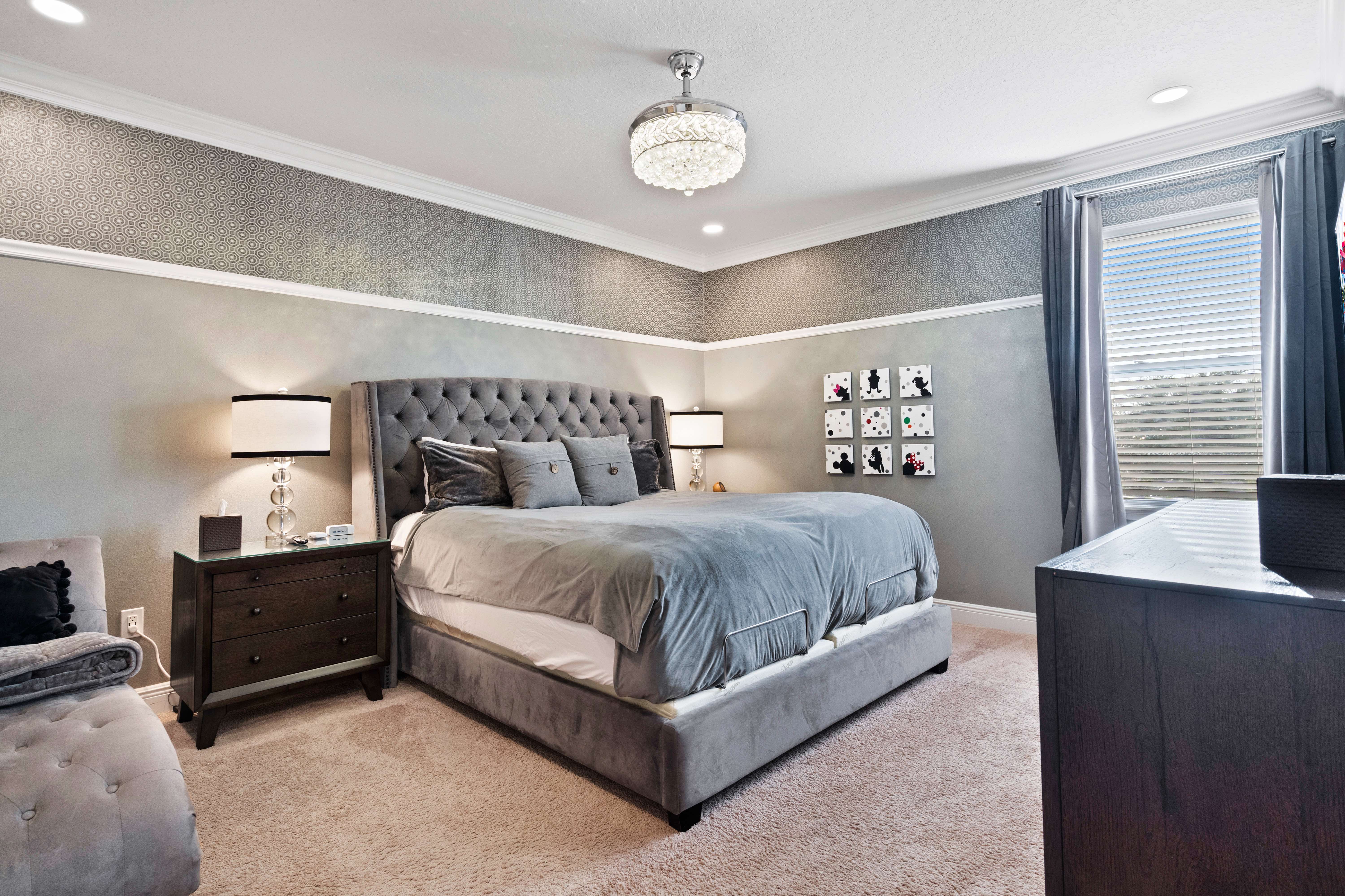 Master bedroom with adjustable split king bed at 450 Burma vacation rental near Disney World