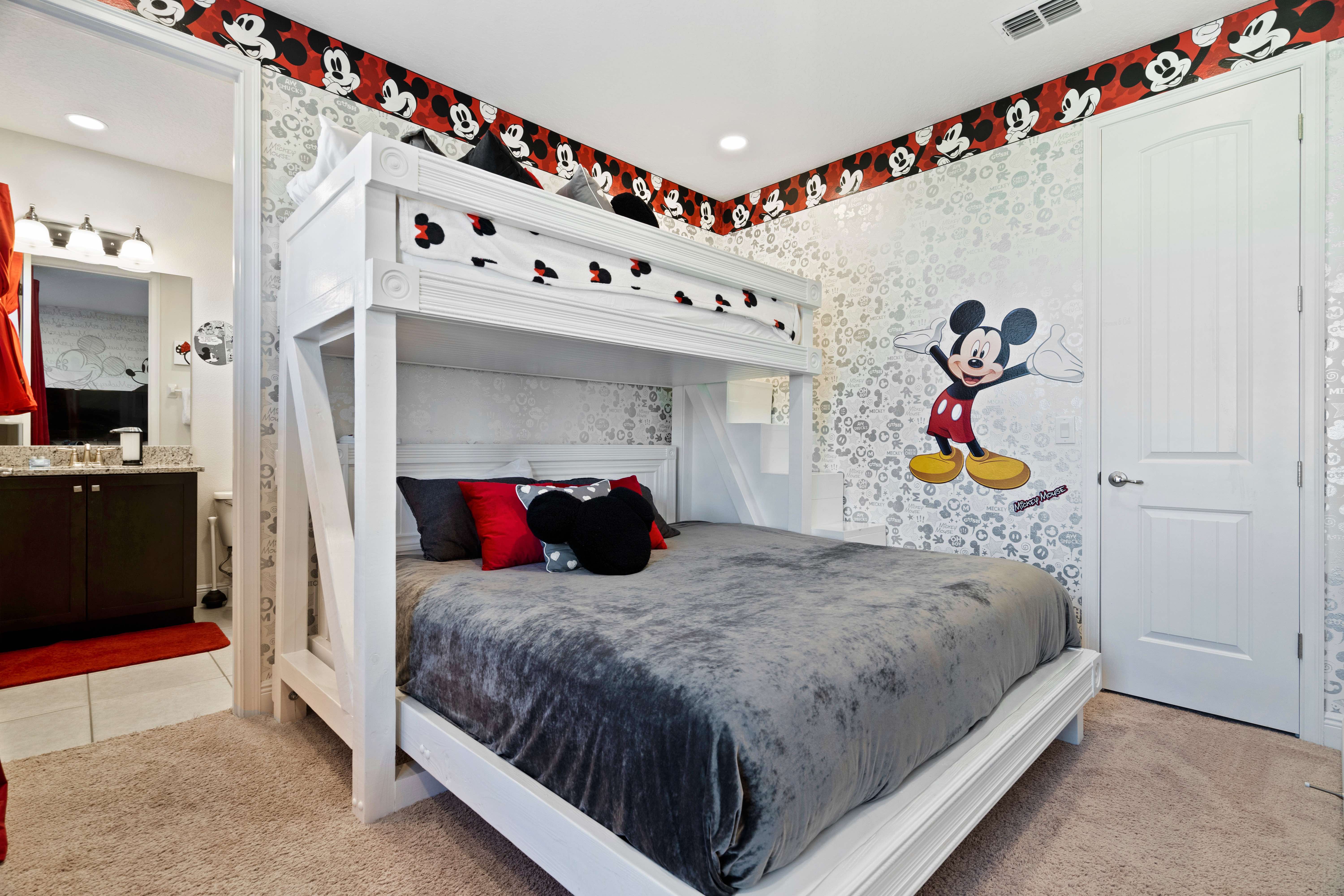 Mickey Mouse bedroom with king bed and bunk beds at 450 Burma vacation rental