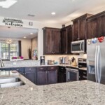 Gourmet kitchen with granite counters at 450 Burma vacation home near Disney