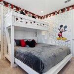 Mickey Mouse bedroom with king bed and bunk beds at 450 Burma vacation rental
