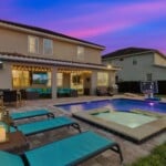 Private pool lit up at night at 450 Burma vacation rental Kissimmee FL