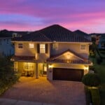 Front of 450 Burma luxury vacation home at night in Encore at Reunion West