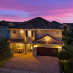 Front of 450 Burma luxury vacation home at night in Encore at Reunion West